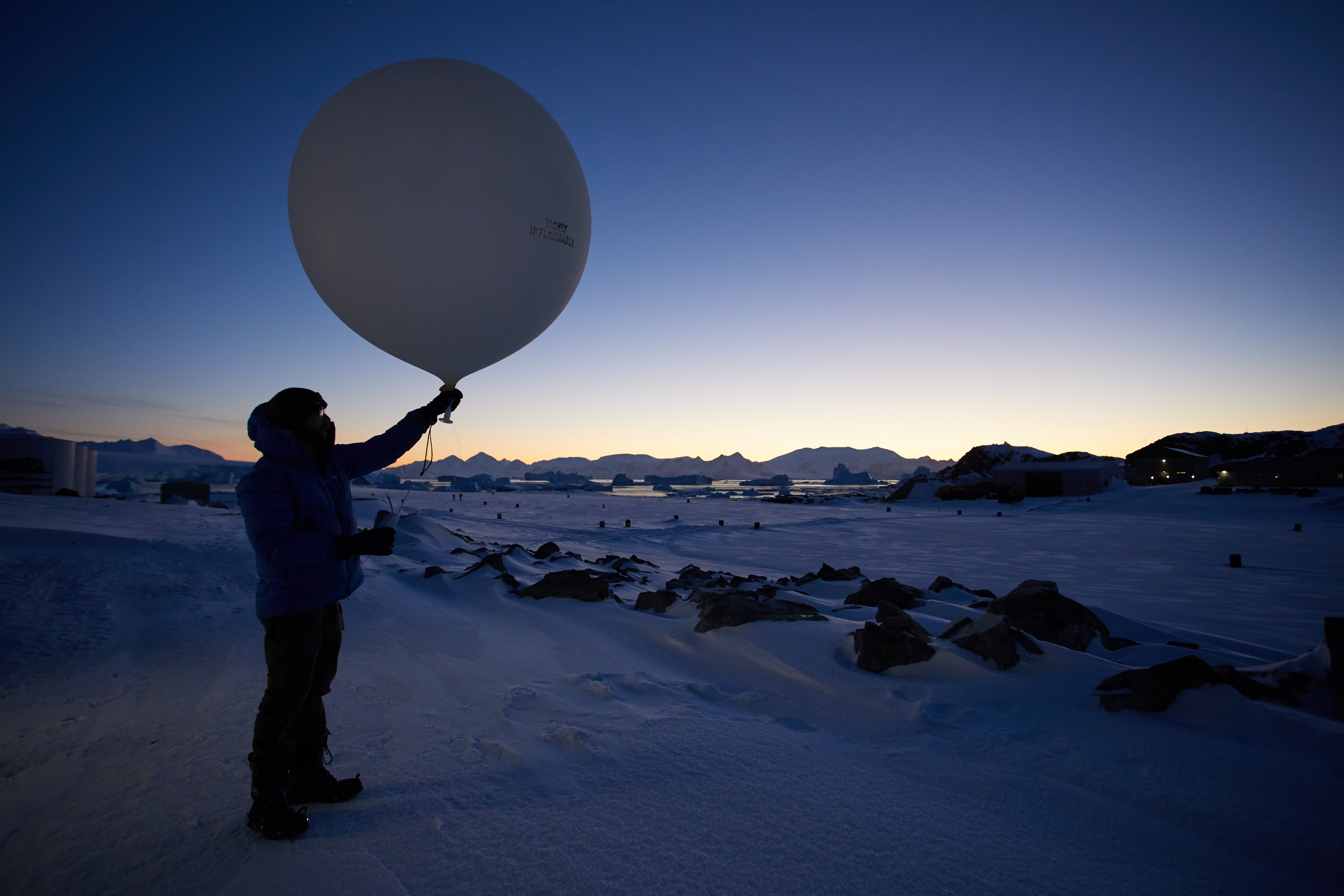 Launching a weather balloon and radiosonde in the Antarctic
