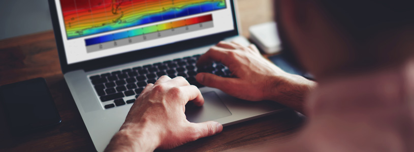 a laptop with hands typing