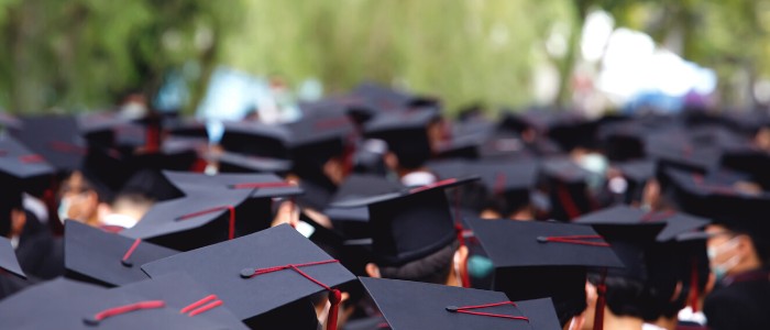 students wearing graduation caps