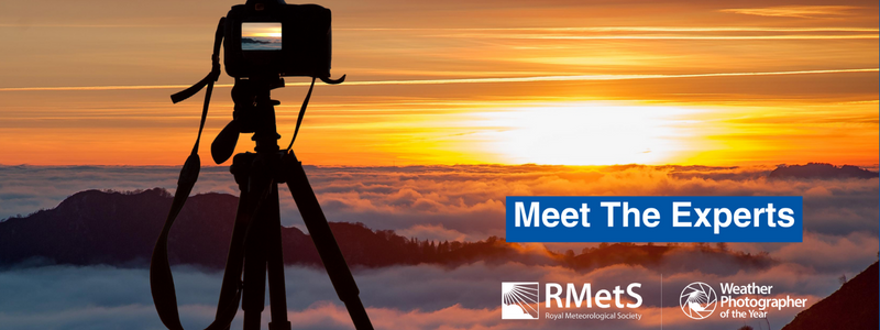 Image of a camera in front of a sunset