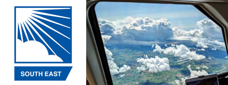 Image of clouds through the window of an aircraft