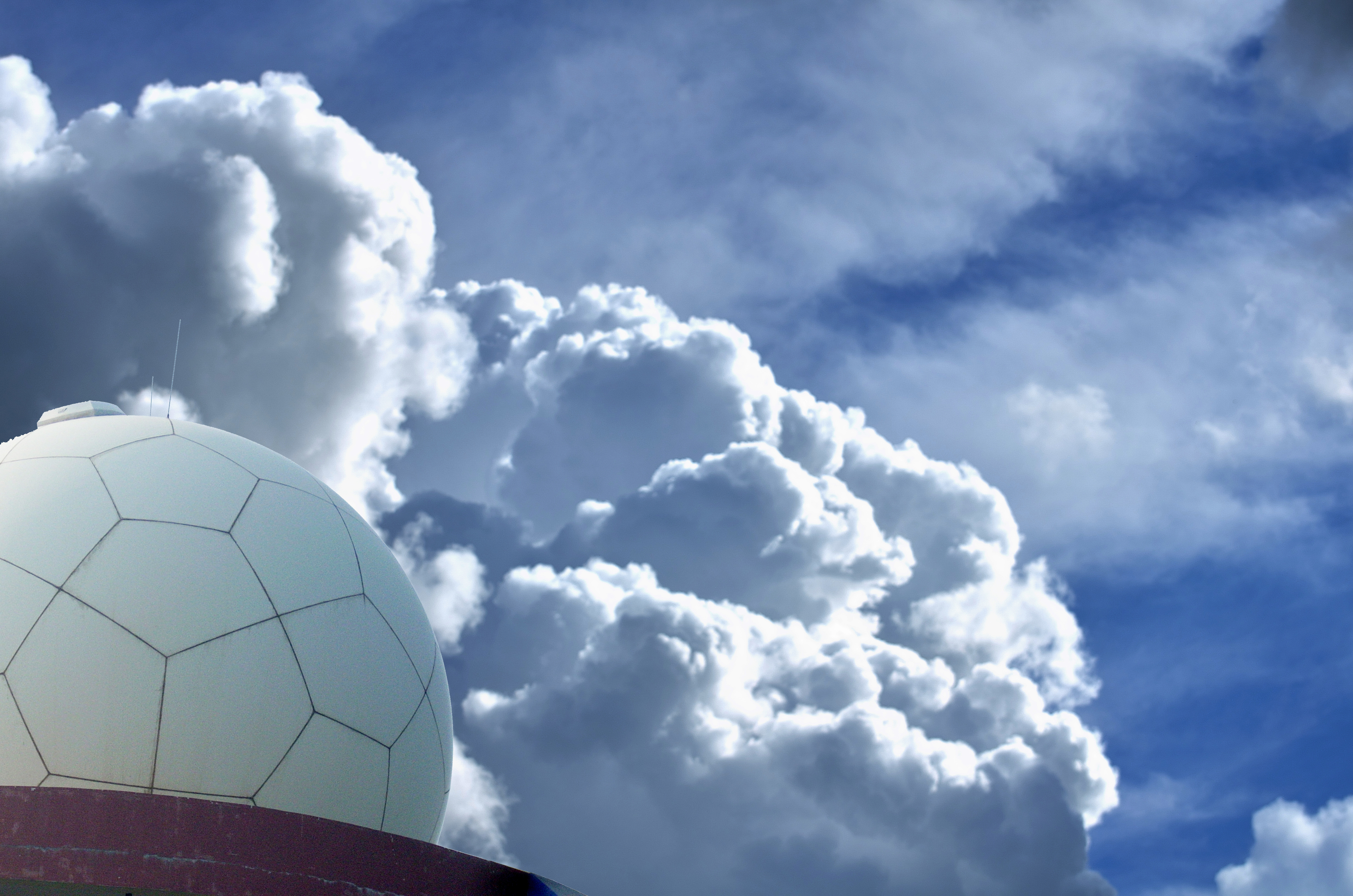 Radar station with clouds in the background