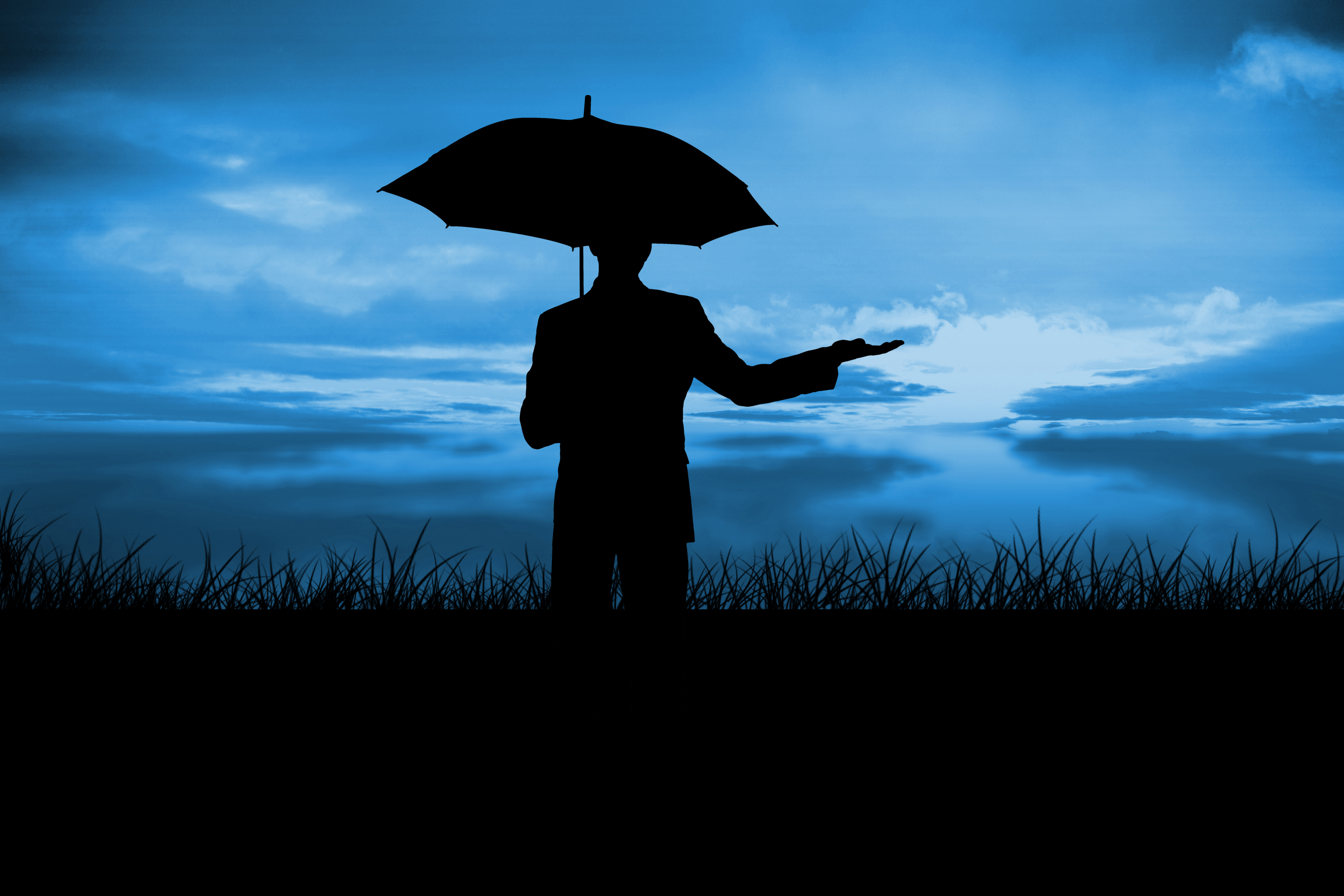 Man under an umbrella checking for rain