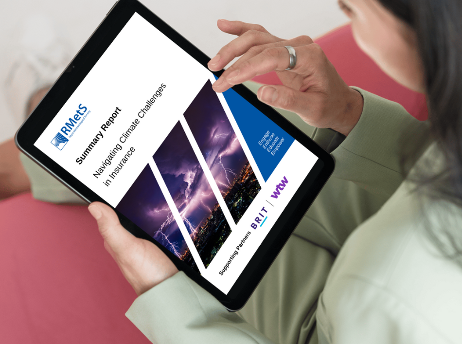 A person reads an RMetS insurance report on a tablet computer