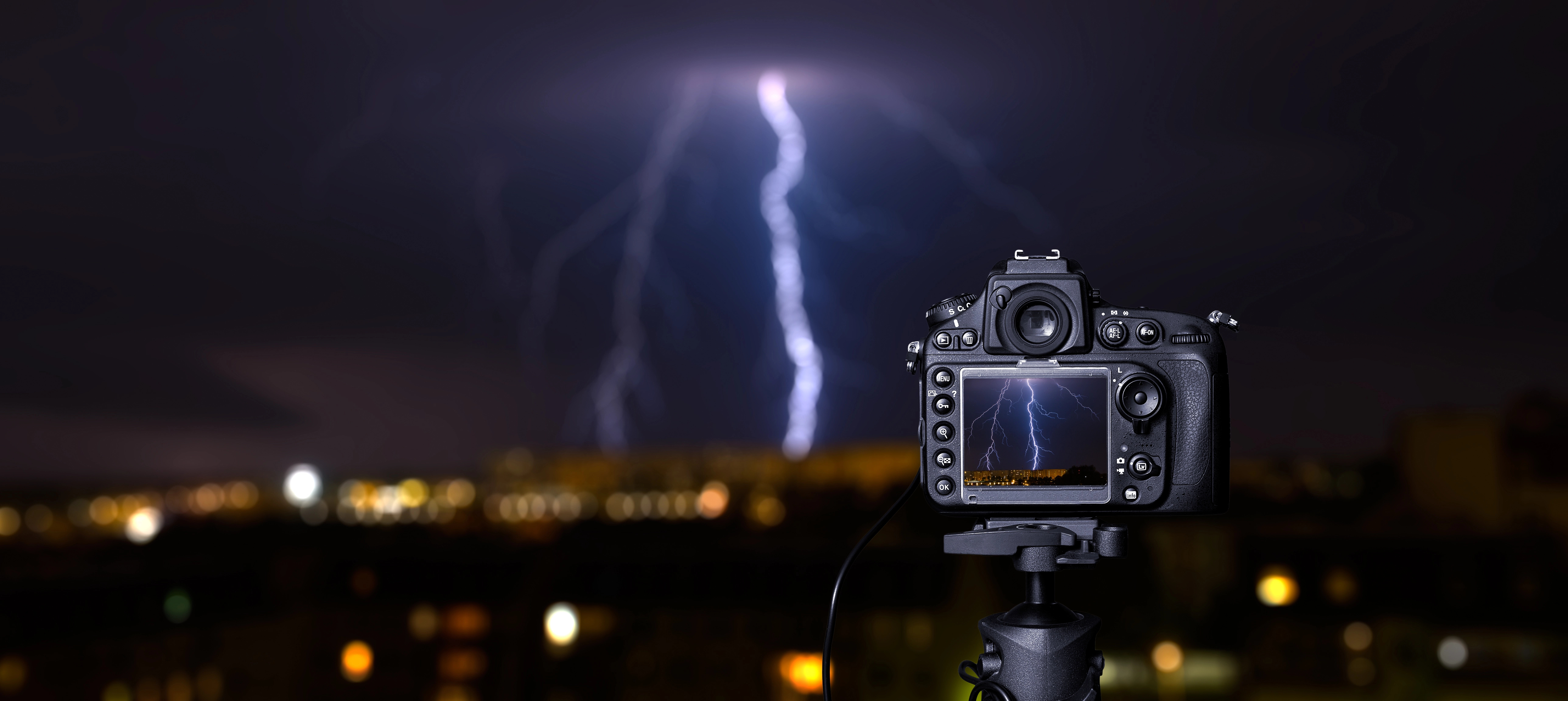 Digital camera screen of a lightning bolt at night