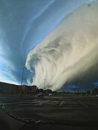A storm cloud looking like a surf wave. Taken through a car windscreen