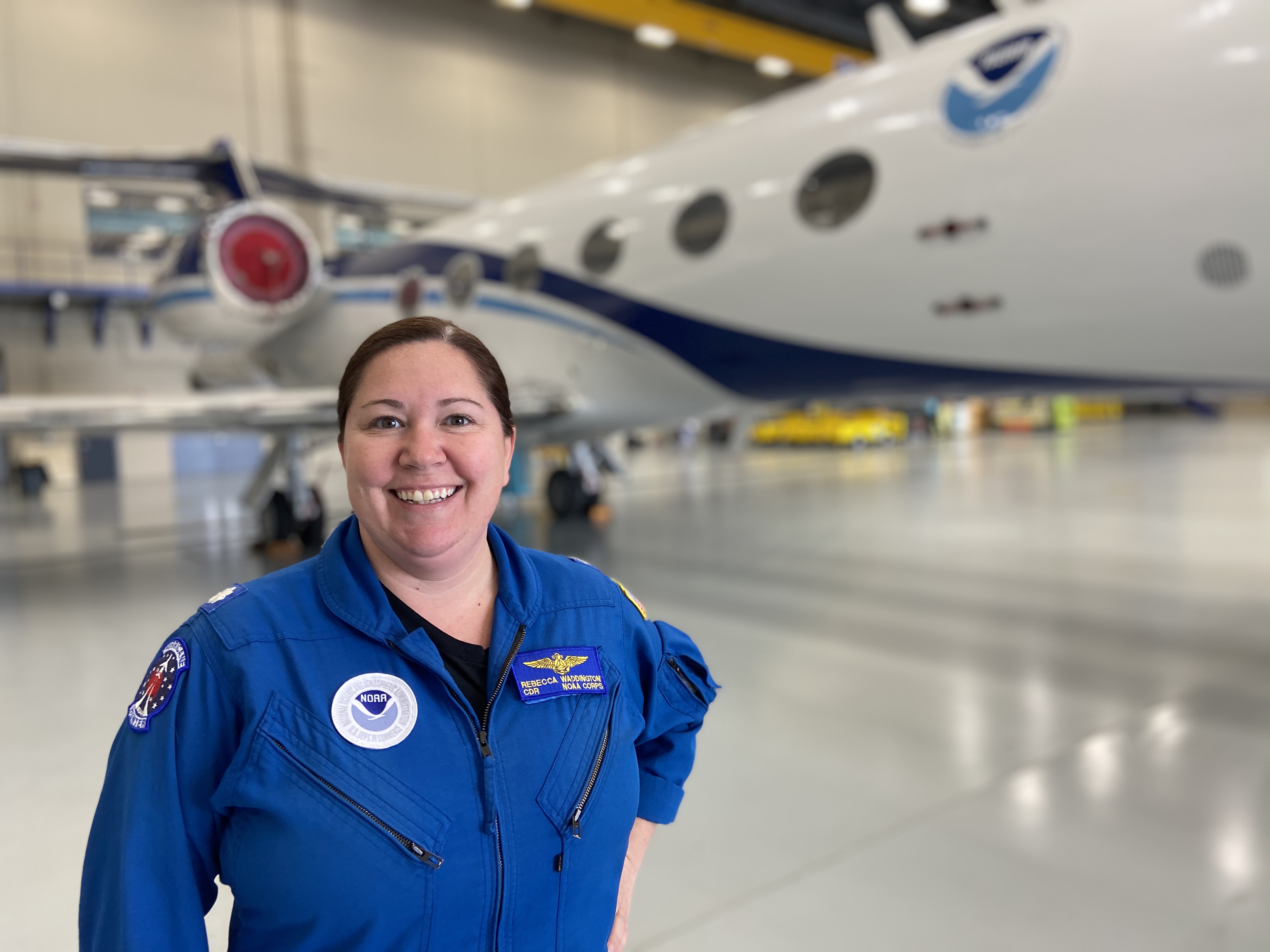 Rebecca Waddington in front of the Gulfstream IV