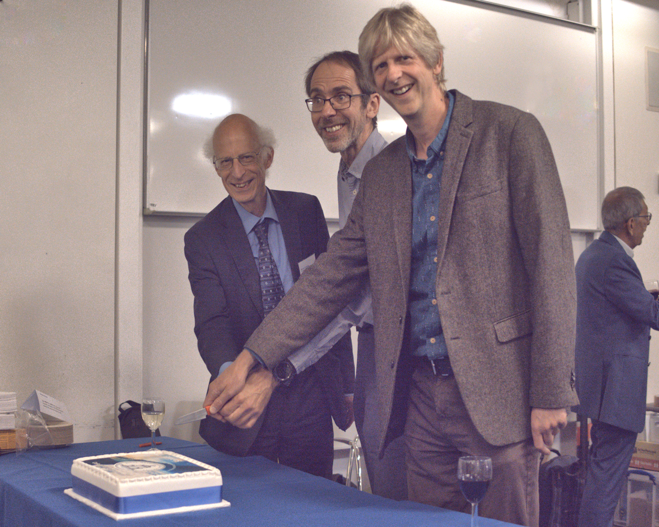 Cake cutting at QJ's 150th anniversary party