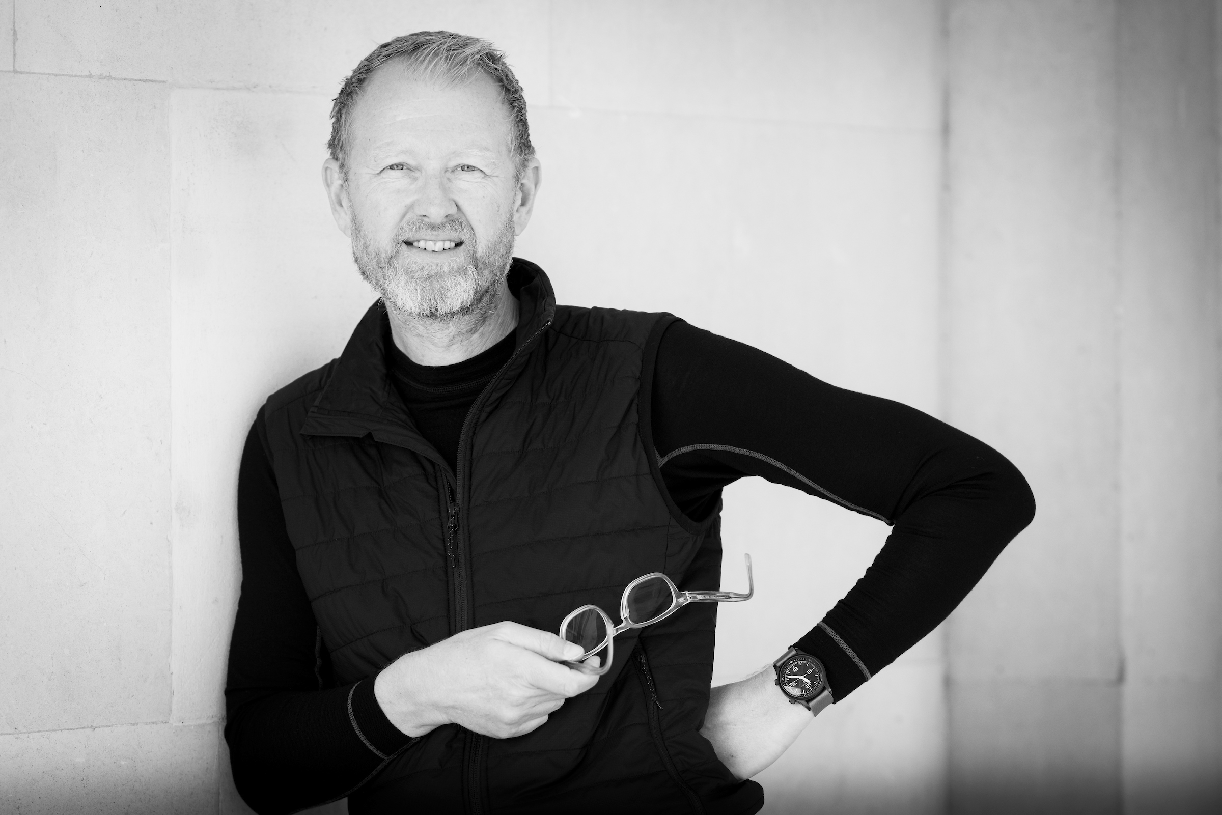 Image of a man holding glasses