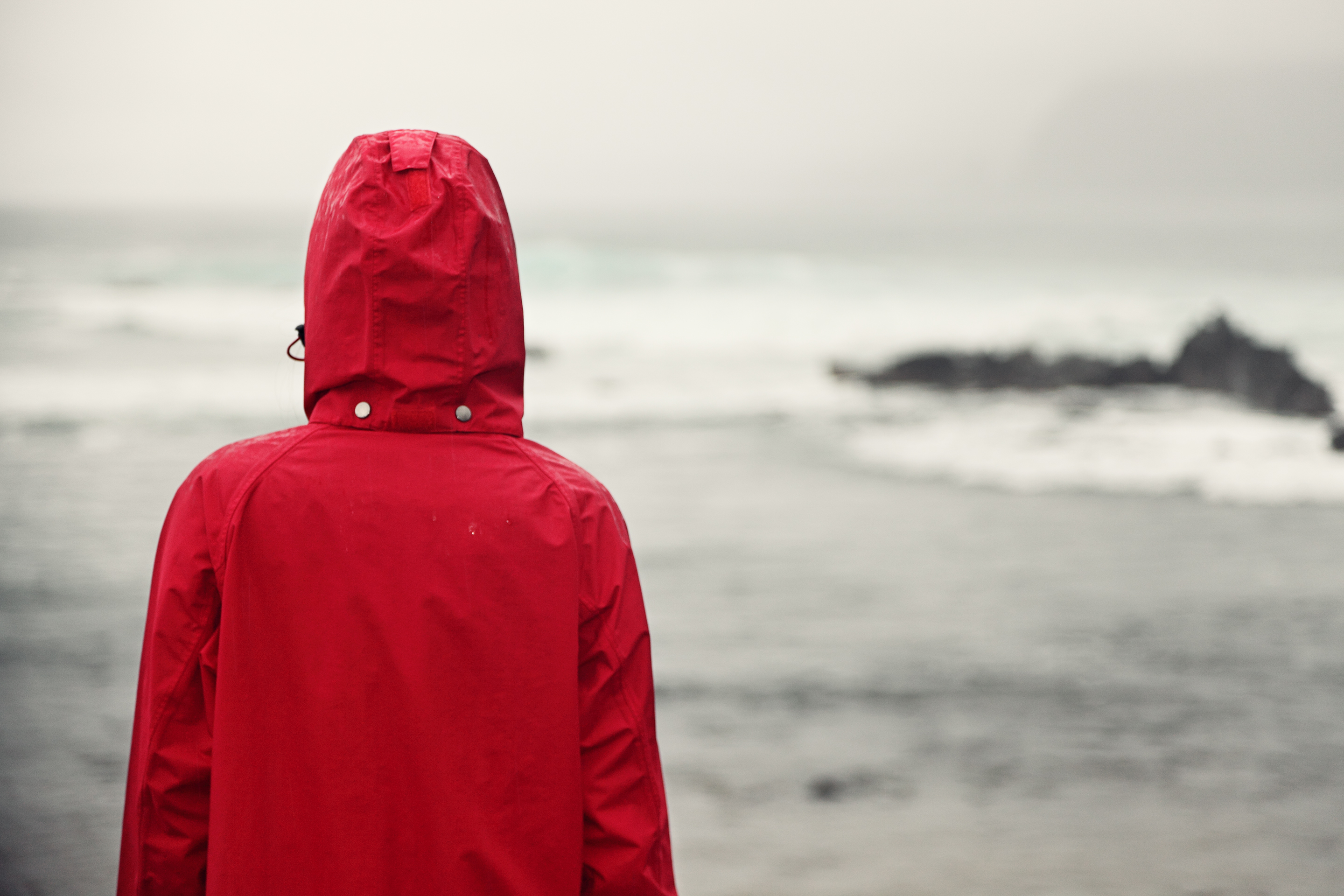 Person looking out at grey skies