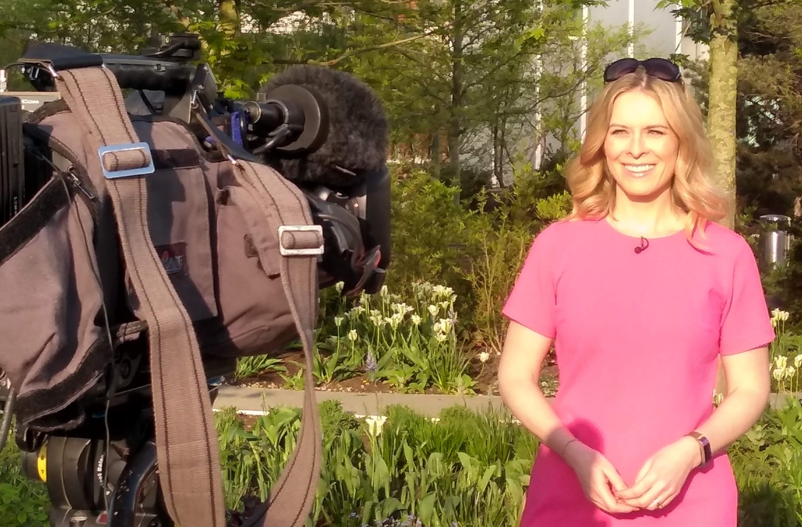 Image of a woman in front of a camera