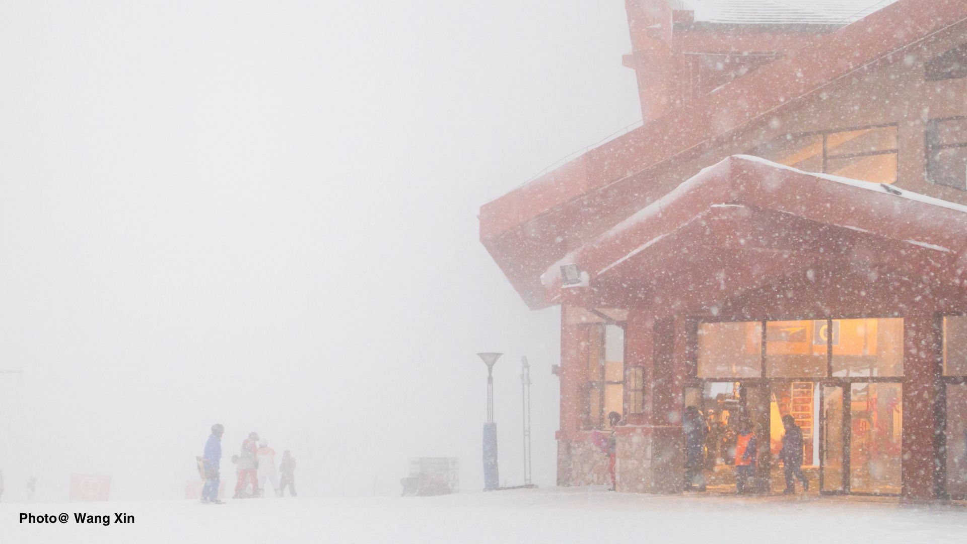 Building with snow falling