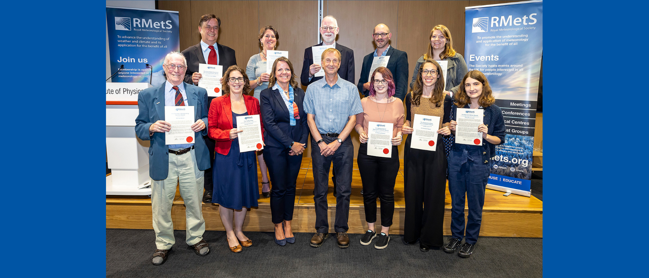 award winners with certificates