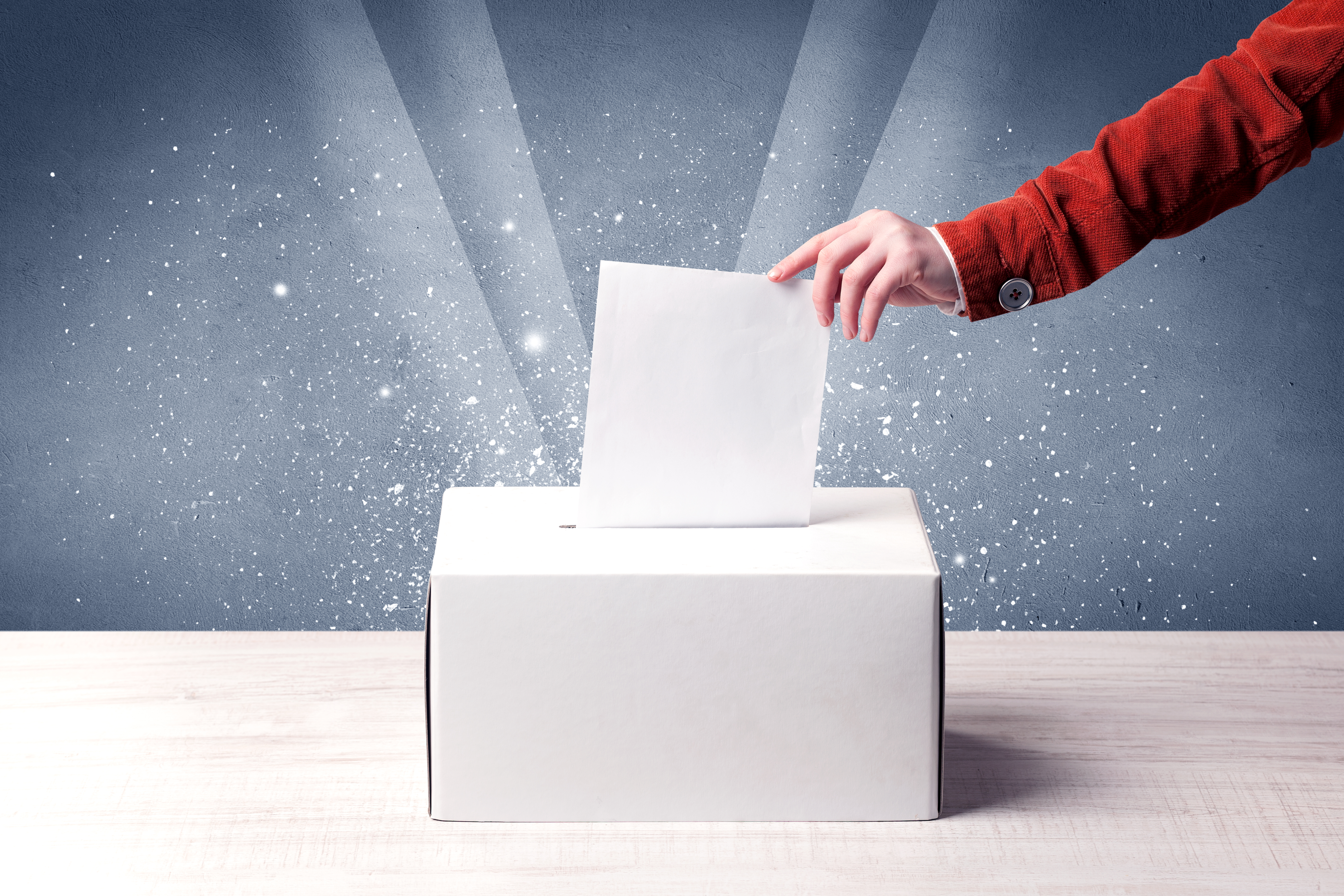 Ballot box with person casting vote