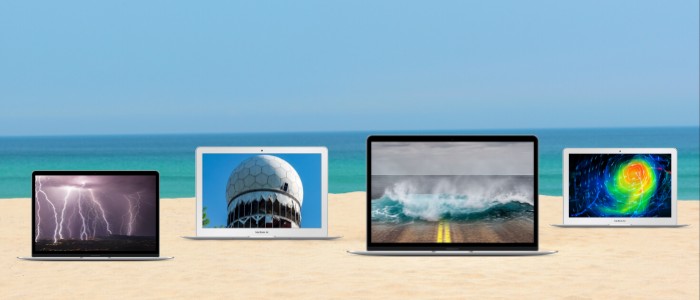 laptops showing virtual events at the beach
