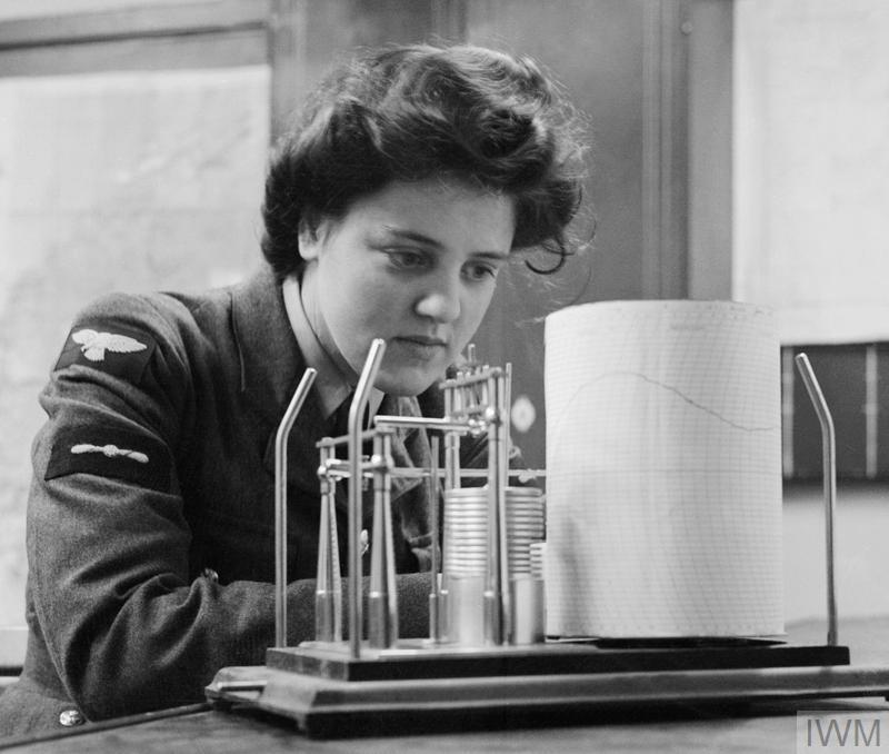 Leading Aircraftwoman M Wishart, a meteorological clerk in the WAAF, takes a weather reading from a thermohygrograph at RAF Pitreavie Castle, Scotland, December 1943 © IWM CH 12199