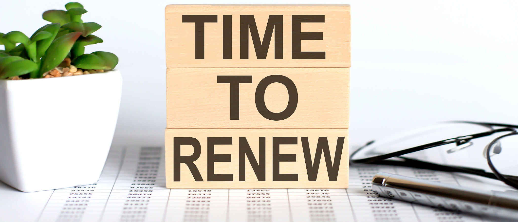 Blocks on a desk saying TIME TO RENEW