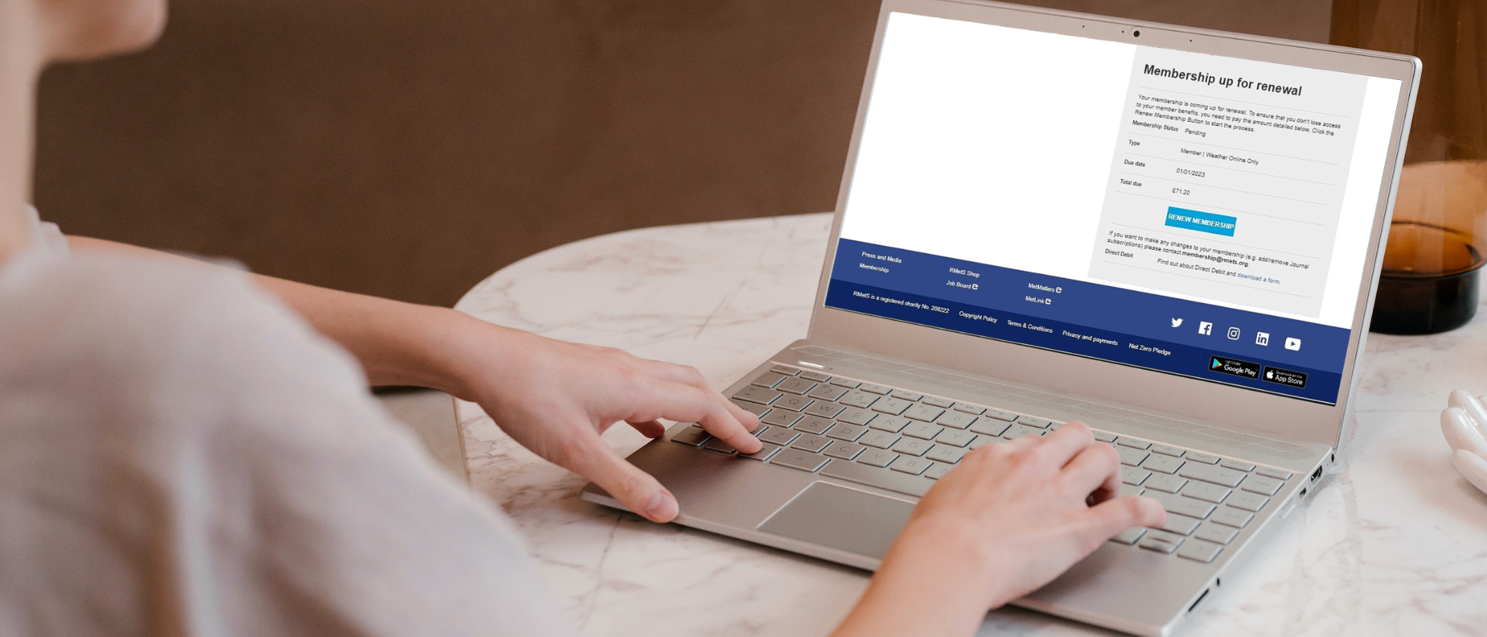 female hands on a laptop looking at the user dashboard renewals option