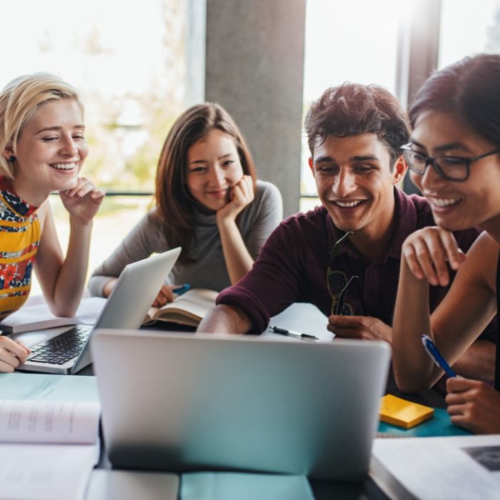 A group of students watch an online event