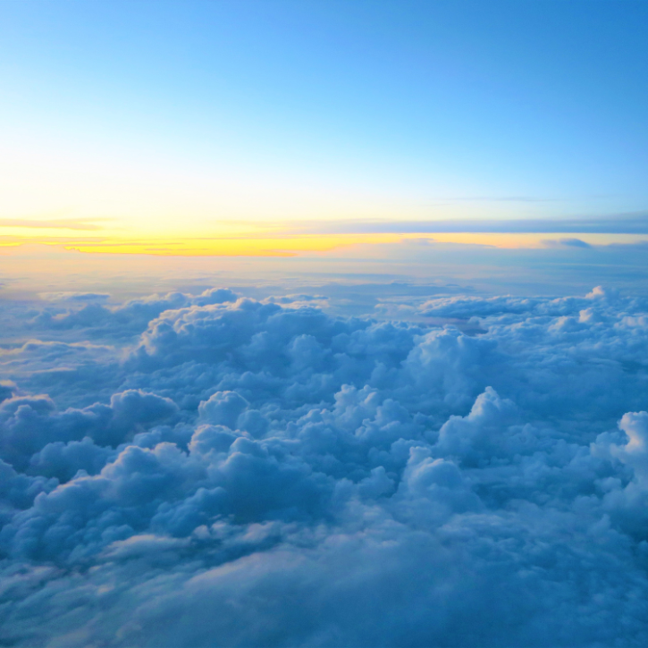 Image of a sunrise above clouds